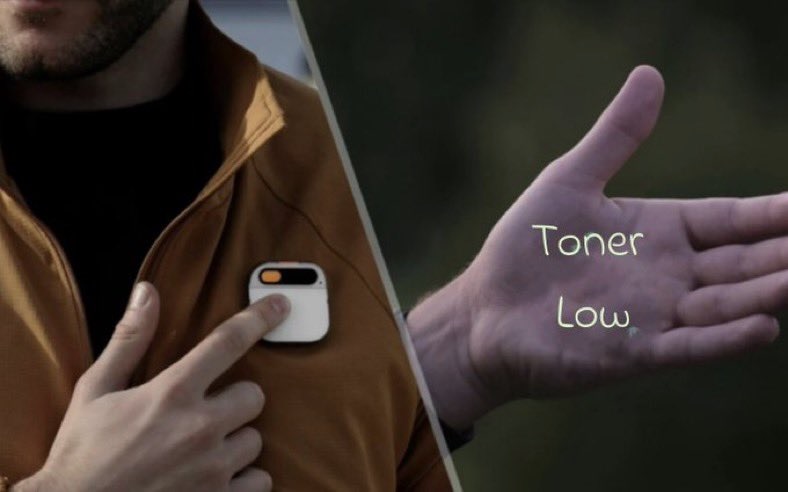 A Humane AI Pin projecting the message "toner low"