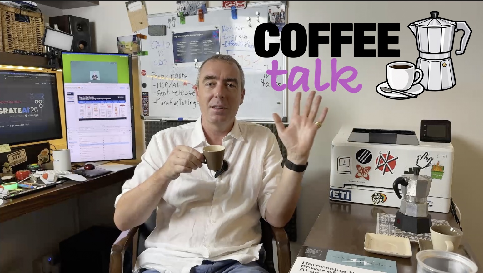 Me waving and holding a coffee cup