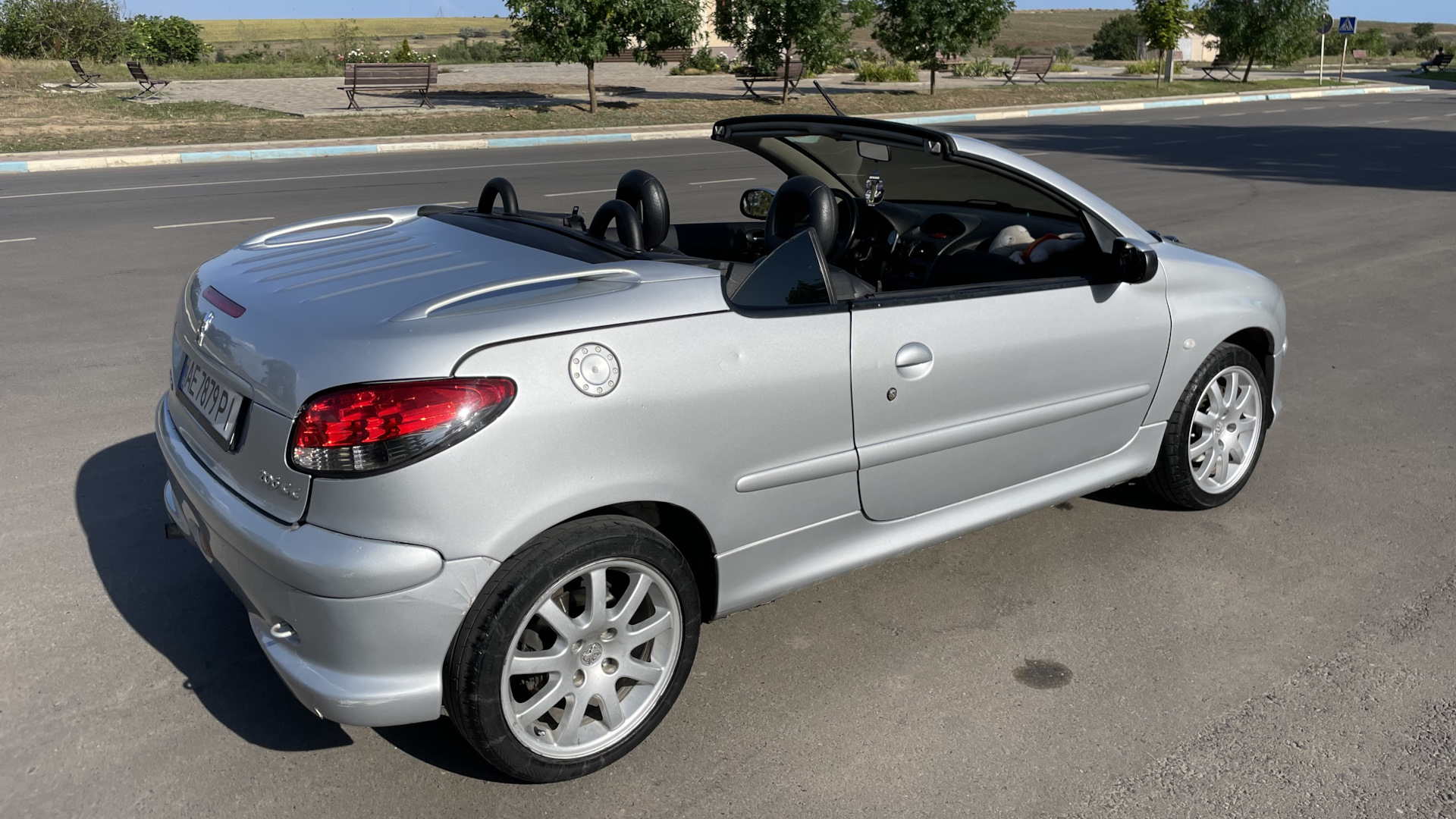 A Peugeot 206 with its top down — not actually my parents' car, but basically its twin
